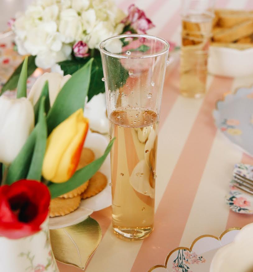 Drinkware including Venetian Champagne Flutes - Set of 6 by Design Ideas on a table.