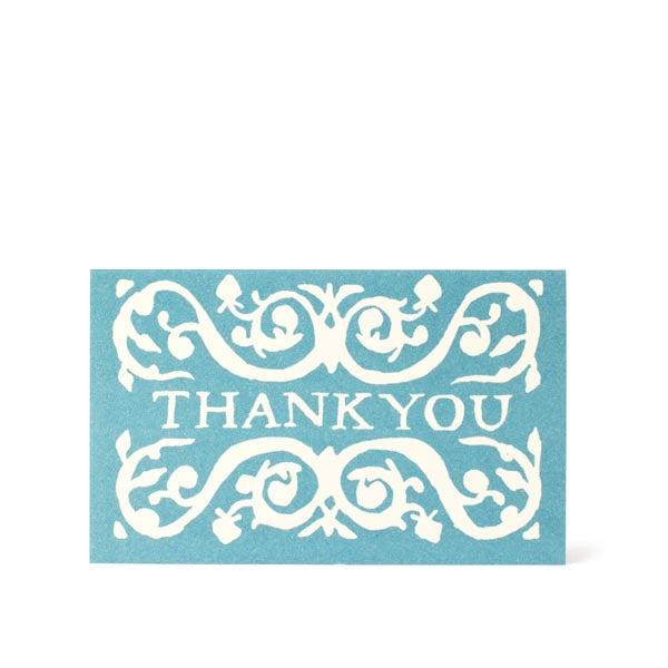 A selection of Cambridge Imprint Arabesque Thank You Cards with intricate designs next to two pencils, crafted on FSC-certified stock.