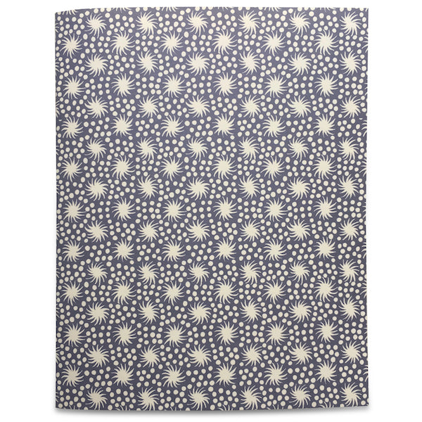 Five colorful Cambridge Imprint Blank Notebooks with patterned covers and three pencils on a marble surface.