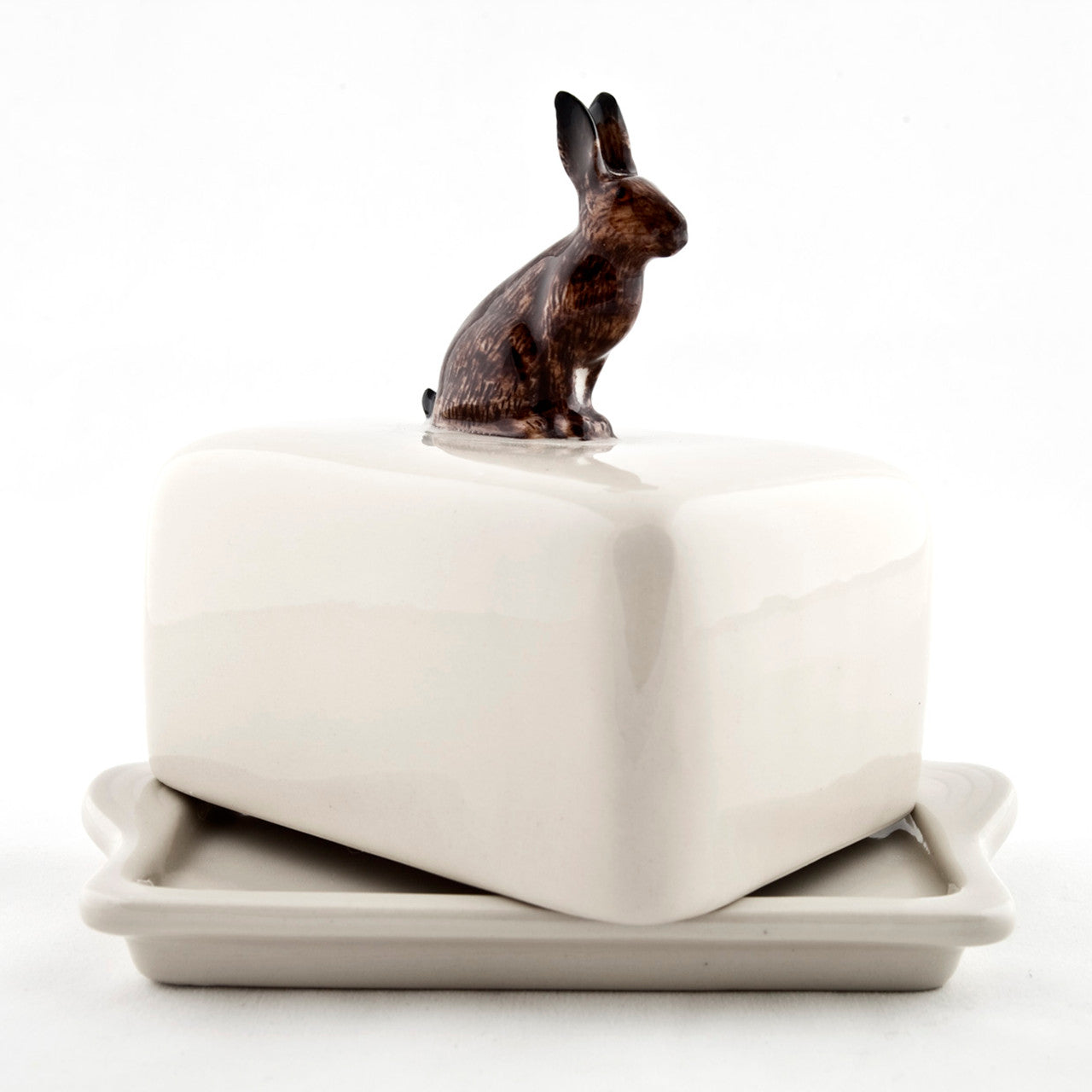 A hand-painted tray with two rabbits and an egg on it by British brand Hare Ceramics.