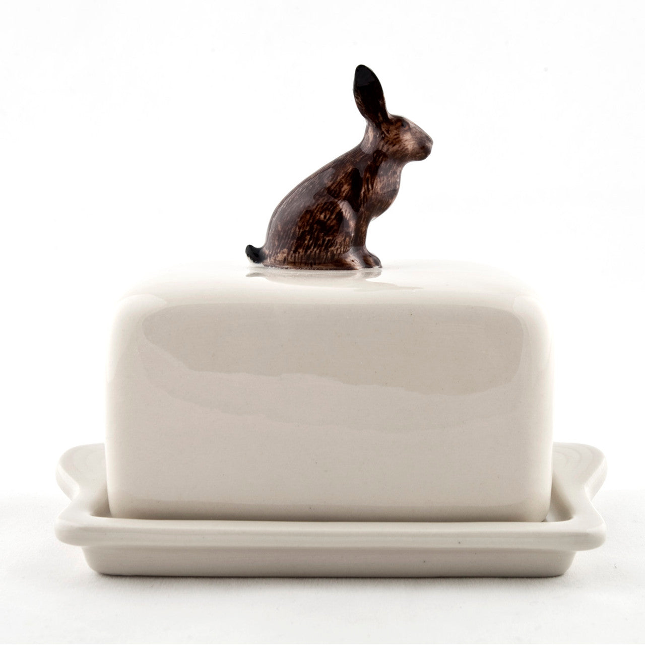 A hand-painted tray with two rabbits and an egg on it by British brand Hare Ceramics.