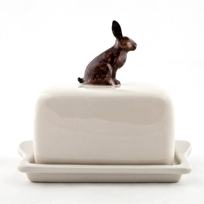 A hand-painted tray with two rabbits and an egg on it by British brand Hare Ceramics.