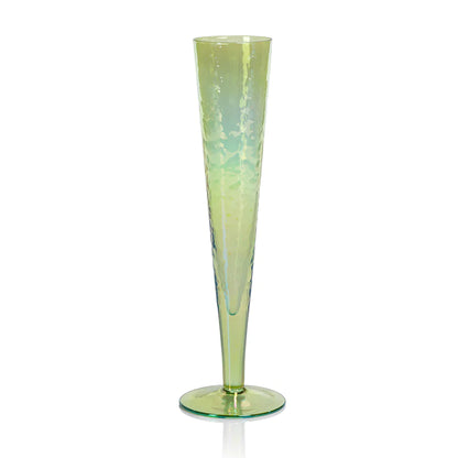 Four Zodax Luster Slim Champagne Flute Glassware with a champagne bottle in an ice bucket in the background.
