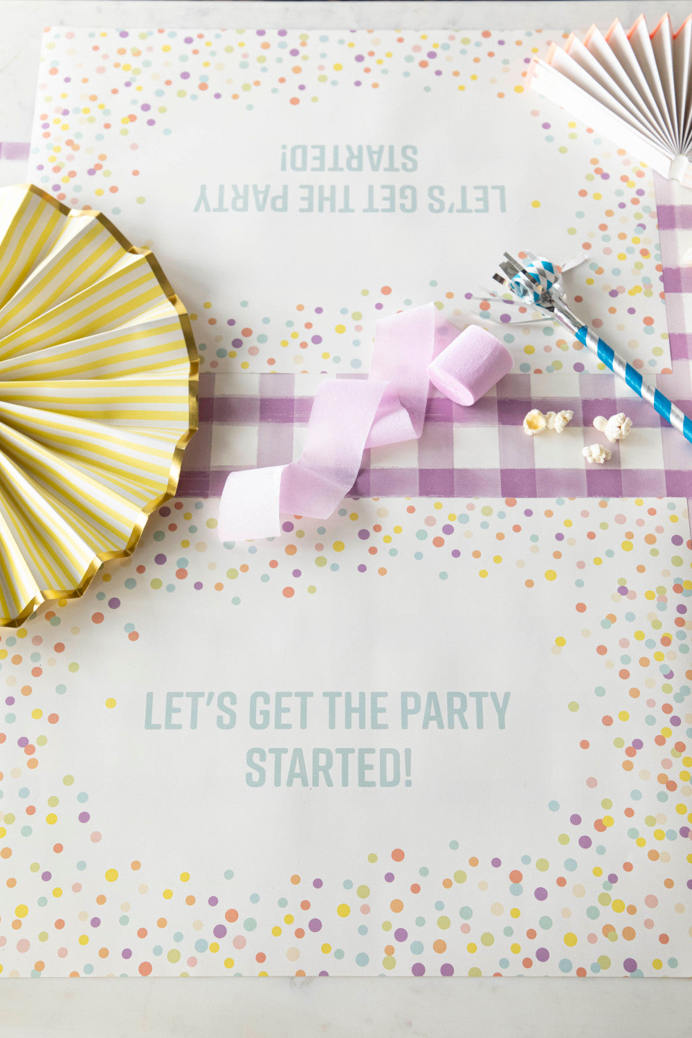 Table setting with Confetti Sprinkles Placemat with personalized message printed in sea foam color: &quot;Let&
