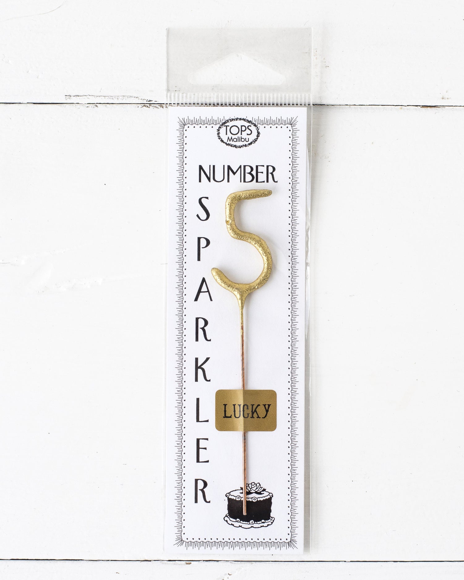 A 4&quot; tall Gold Number Cake Topper Sparkler with the number 5 on it, perfect for an instant party from Tops Malibu.