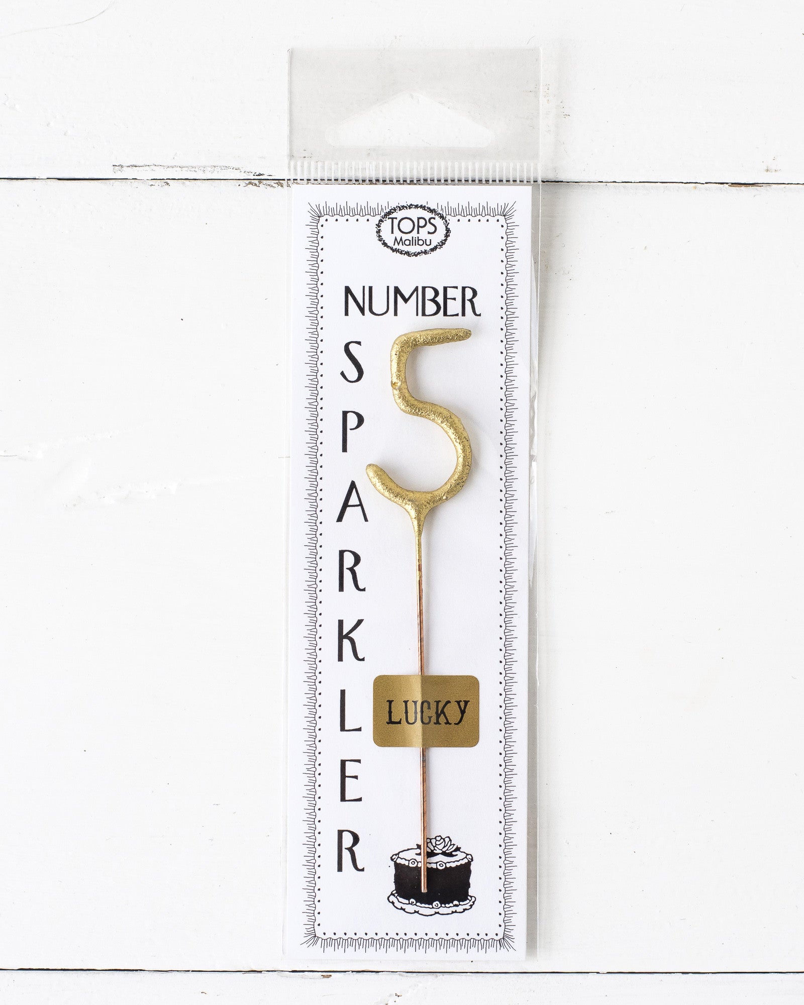 A 4&quot; tall Gold Number Cake Topper Sparkler with the number 5 on it, perfect for an instant party from Tops Malibu.