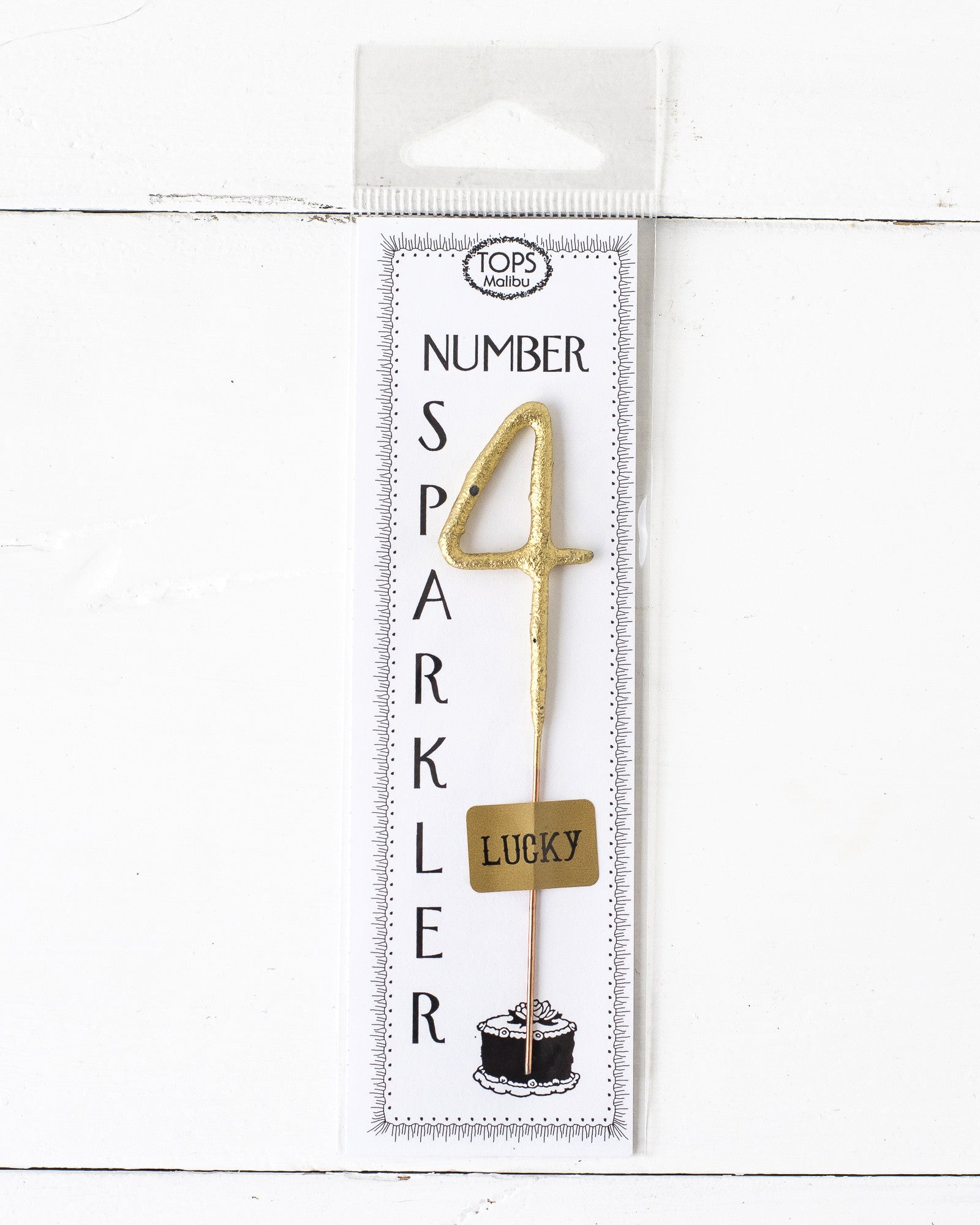 A 4&quot; tall Gold Number Cake Topper Sparkler on a white background by Tops Malibu.