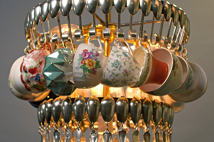 An unconventional Double Teacup chandelier made from suspended silverware and vintage teacups by Hester &amp; Cook.