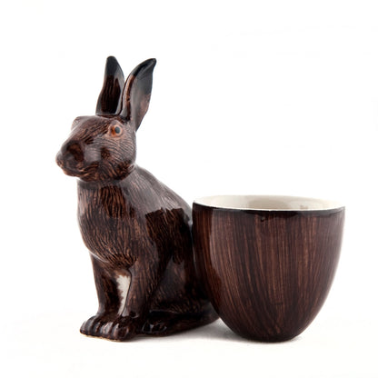 A hand-painted tray with two rabbits and an egg on it by British brand Hare Ceramics.