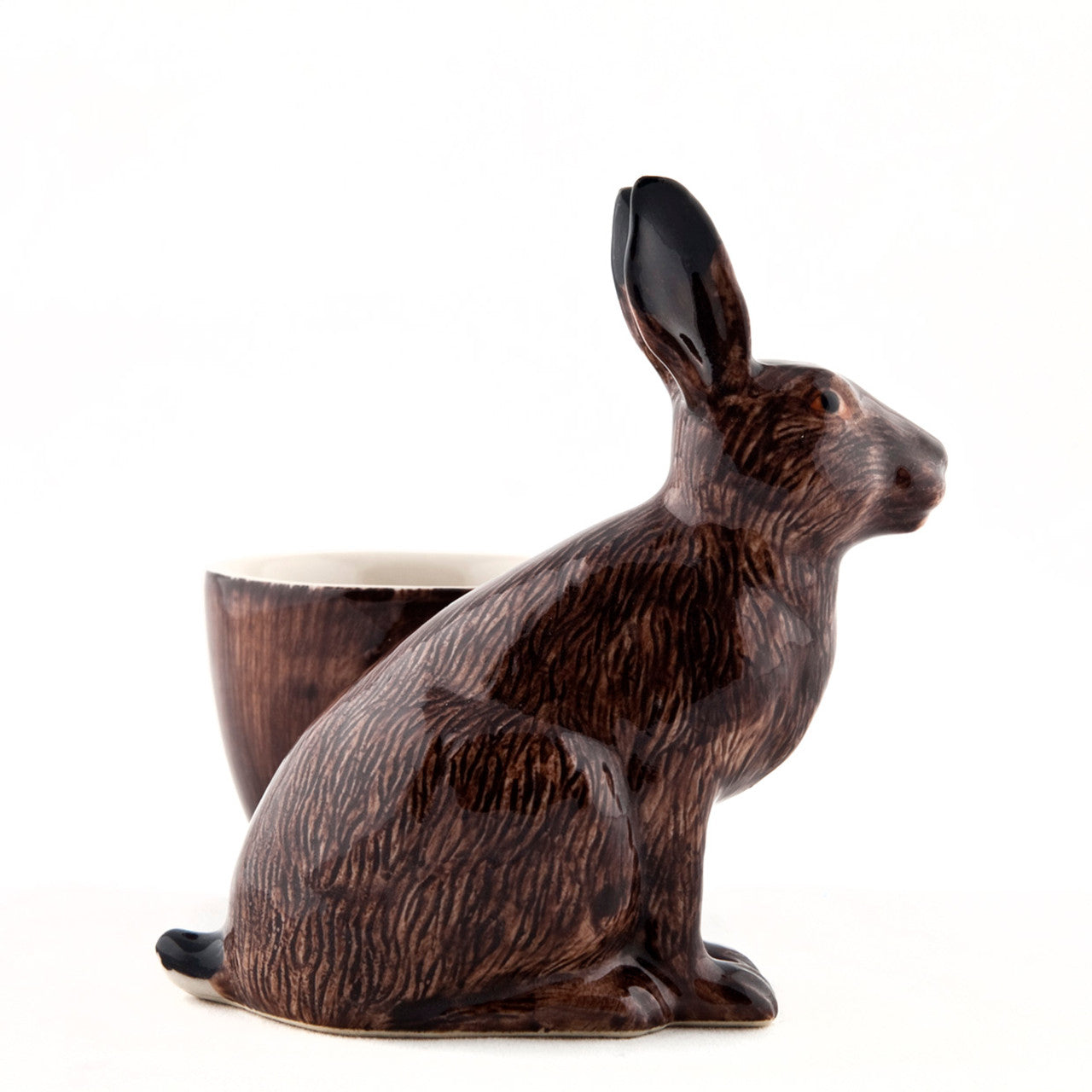 A hand-painted tray with two rabbits and an egg on it by British brand Hare Ceramics.