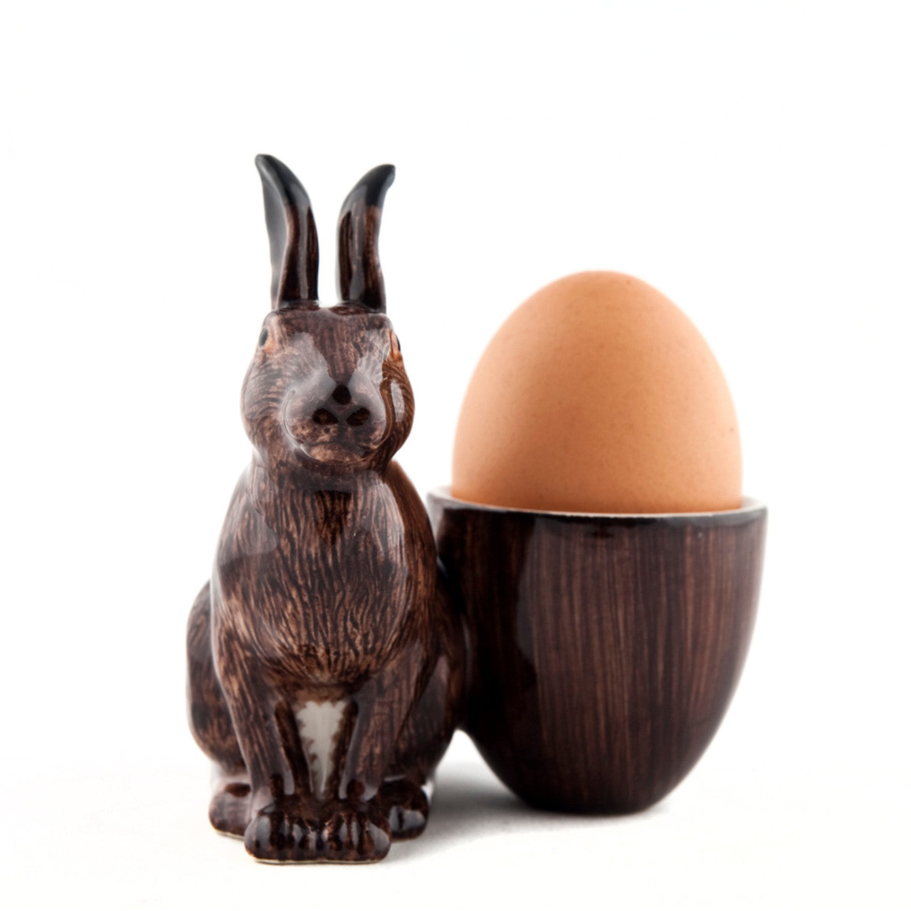 A hand-painted tray with two rabbits and an egg on it by British brand Hare Ceramics.