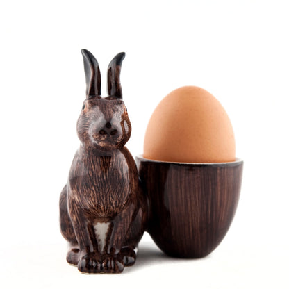 A hand-painted tray with two rabbits and an egg on it by British brand Hare Ceramics.