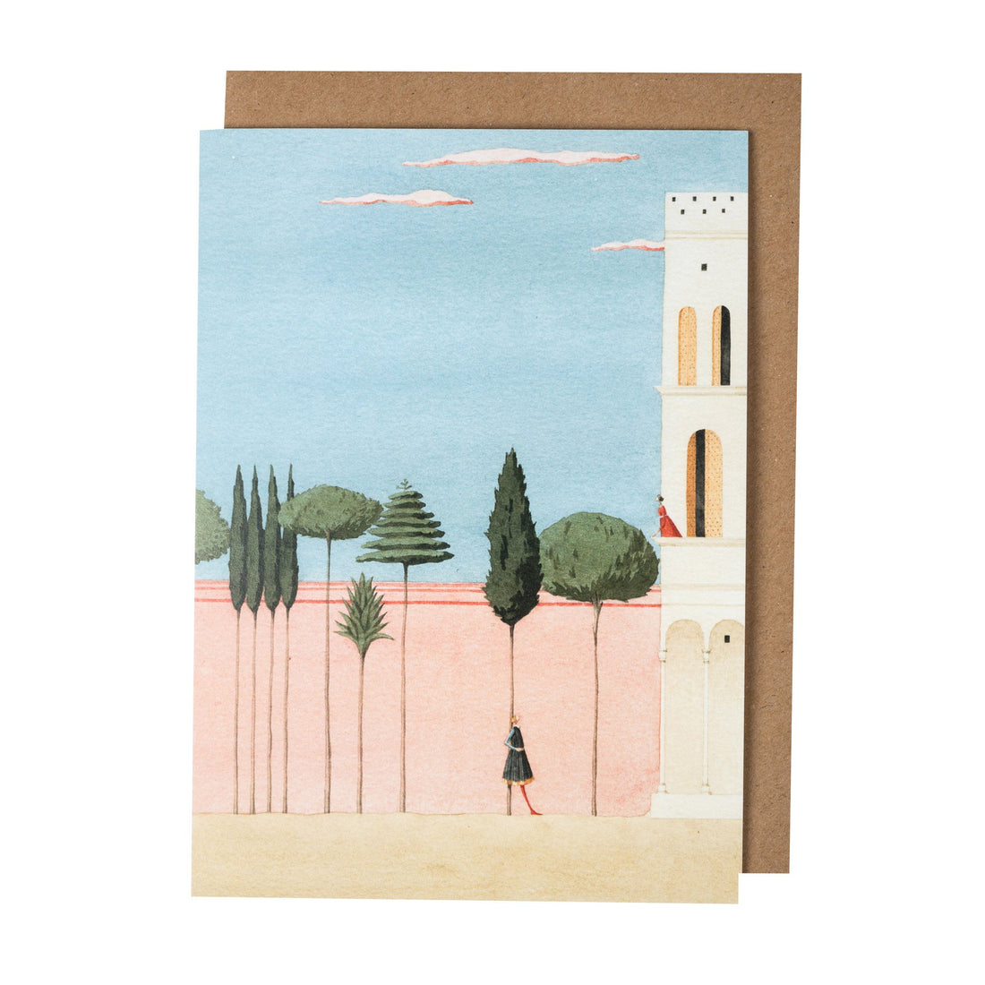 A greeting card featuring a stylized watercolor illustration of the balcony scene from Romeo and Juliet: Romeo stands in a courtyard with a pink wall and tall trees, while Juliet stands above him on the balcony of a tall white tower. The included kraft paper envelope is tucked behind the card. 
