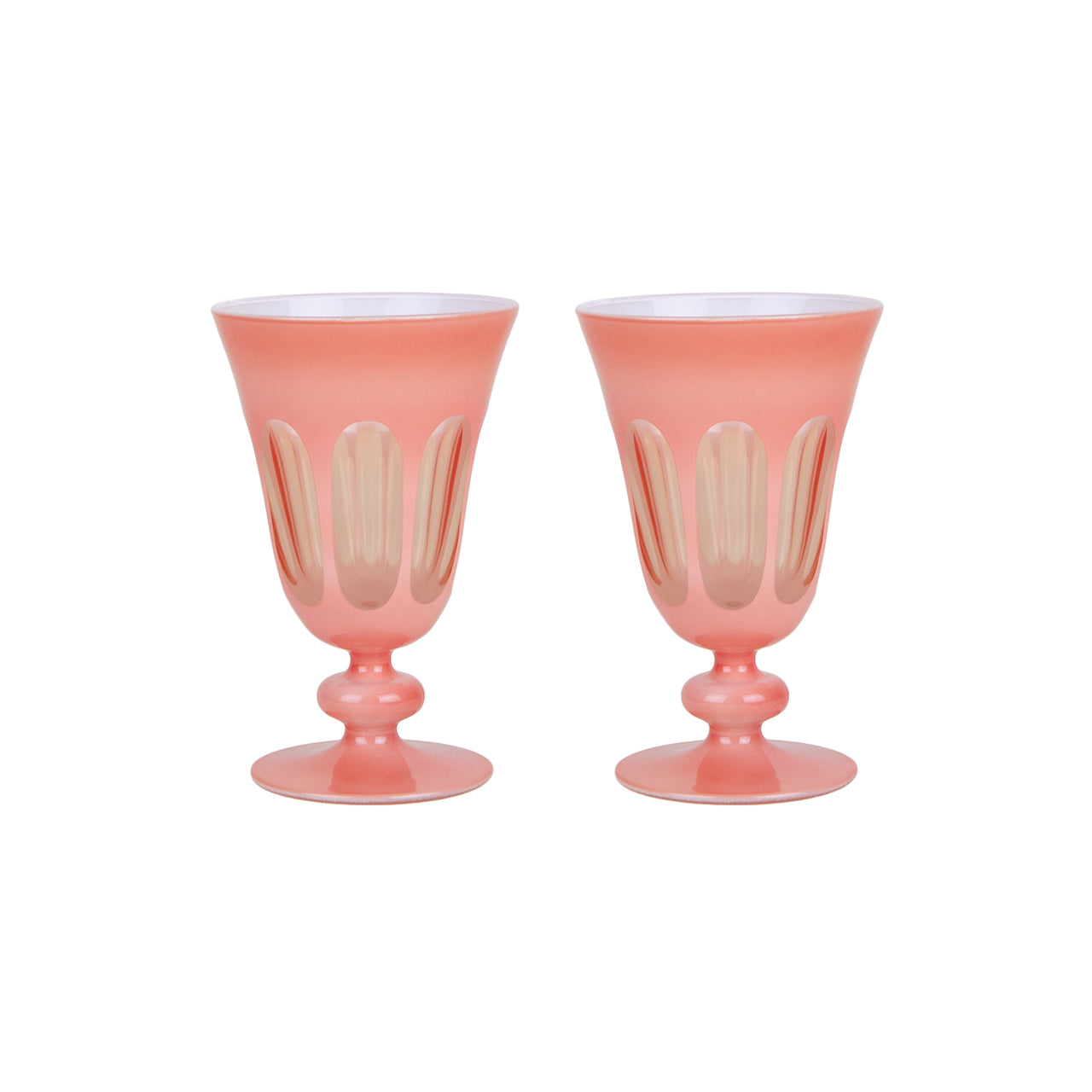 A set of four Rialto Salmon Glasses by SIR/MADAM on a white surface.