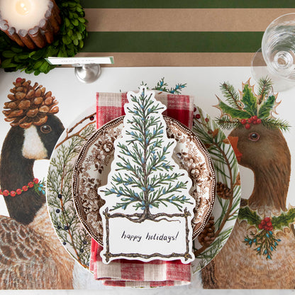 The Festive Geese Placemat under a festive winter-themed place setting, from above.