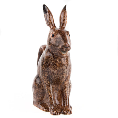 A hand-painted tray with two rabbits and an egg on it by British brand Hare Ceramics.