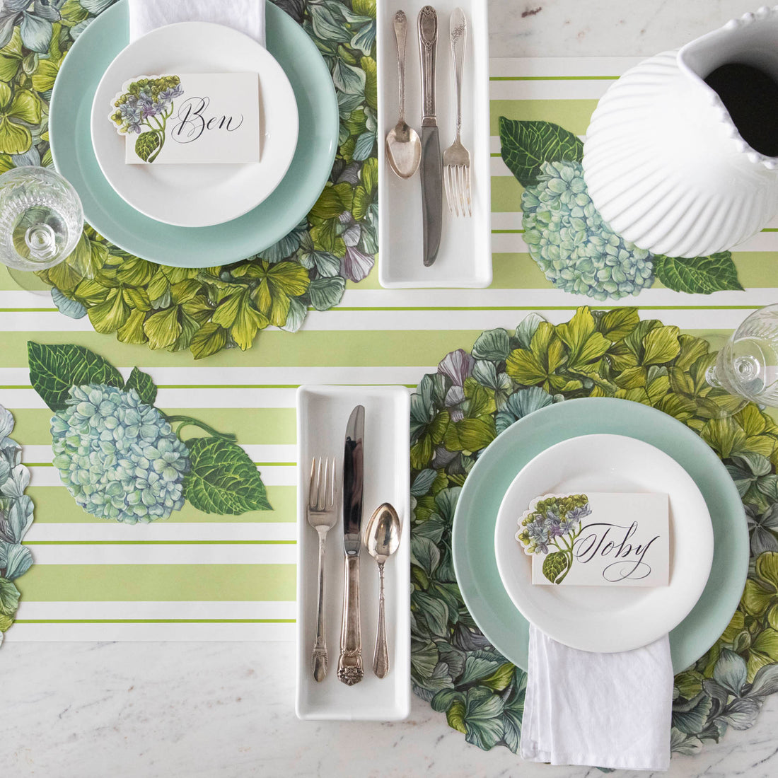 The Die-cut Hydrangea Placemat under an elegant table setting, from above.