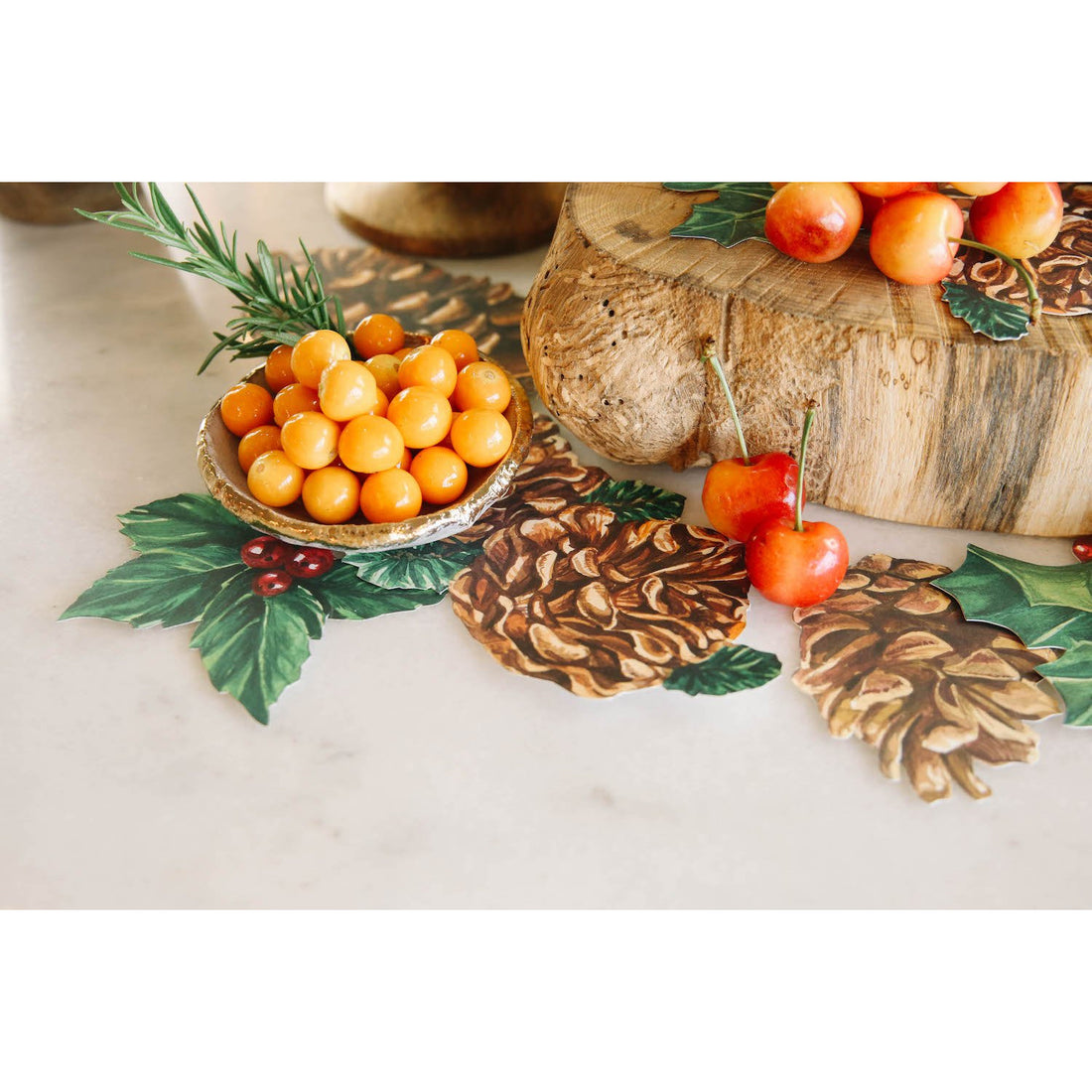 Close-up of a Holiday grazing table with Winter Botanicals Serving Confetti tucked under a bowl of fruit and scattered around the table.
