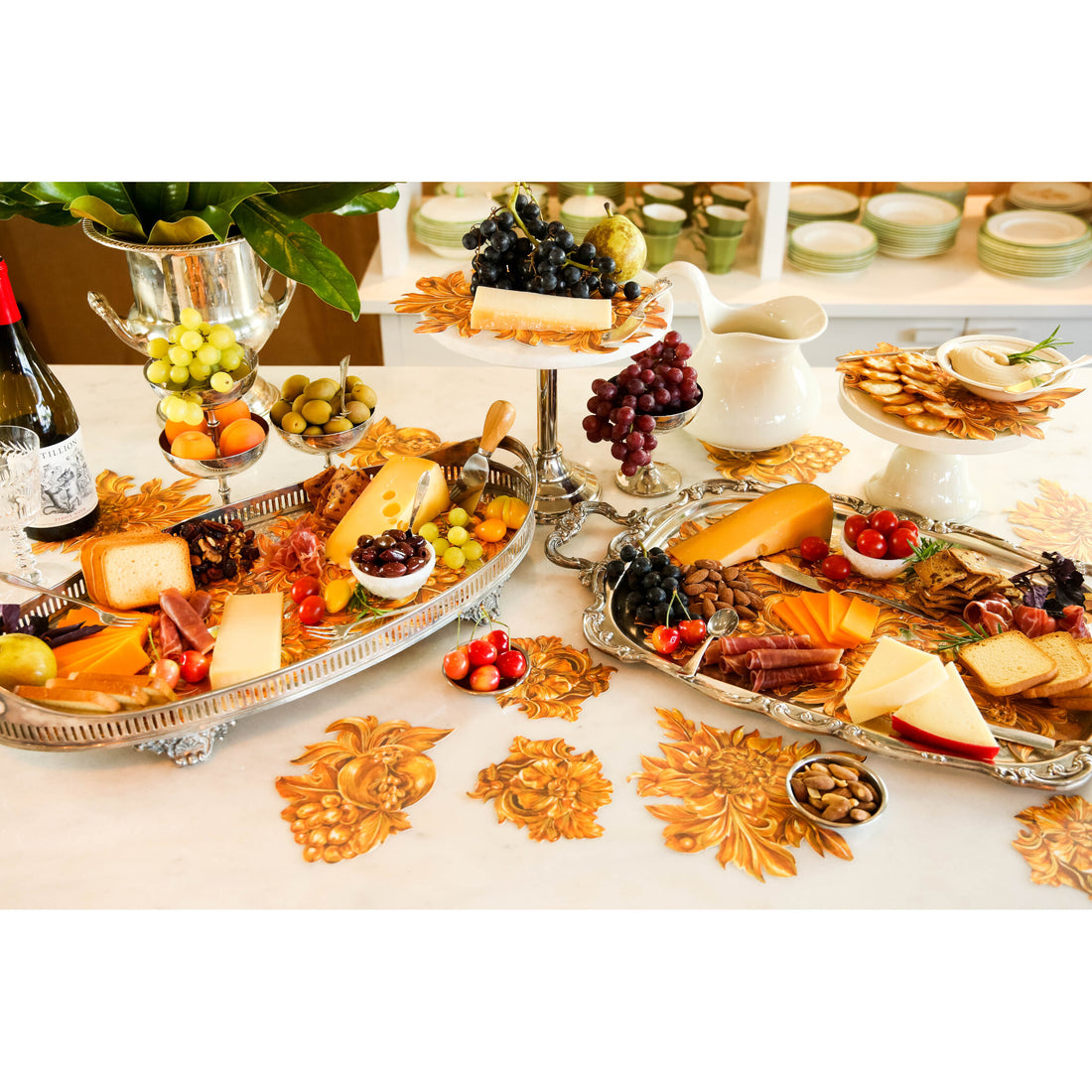 An elegant charcuterie spread featuring Gold Flora Serving Confetti scattered across the table.