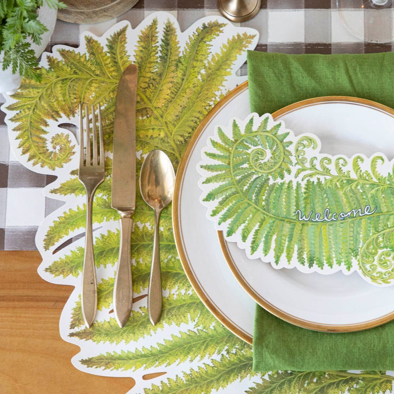 The Die-cut Fern Placemat under an elegant place setting, from above.