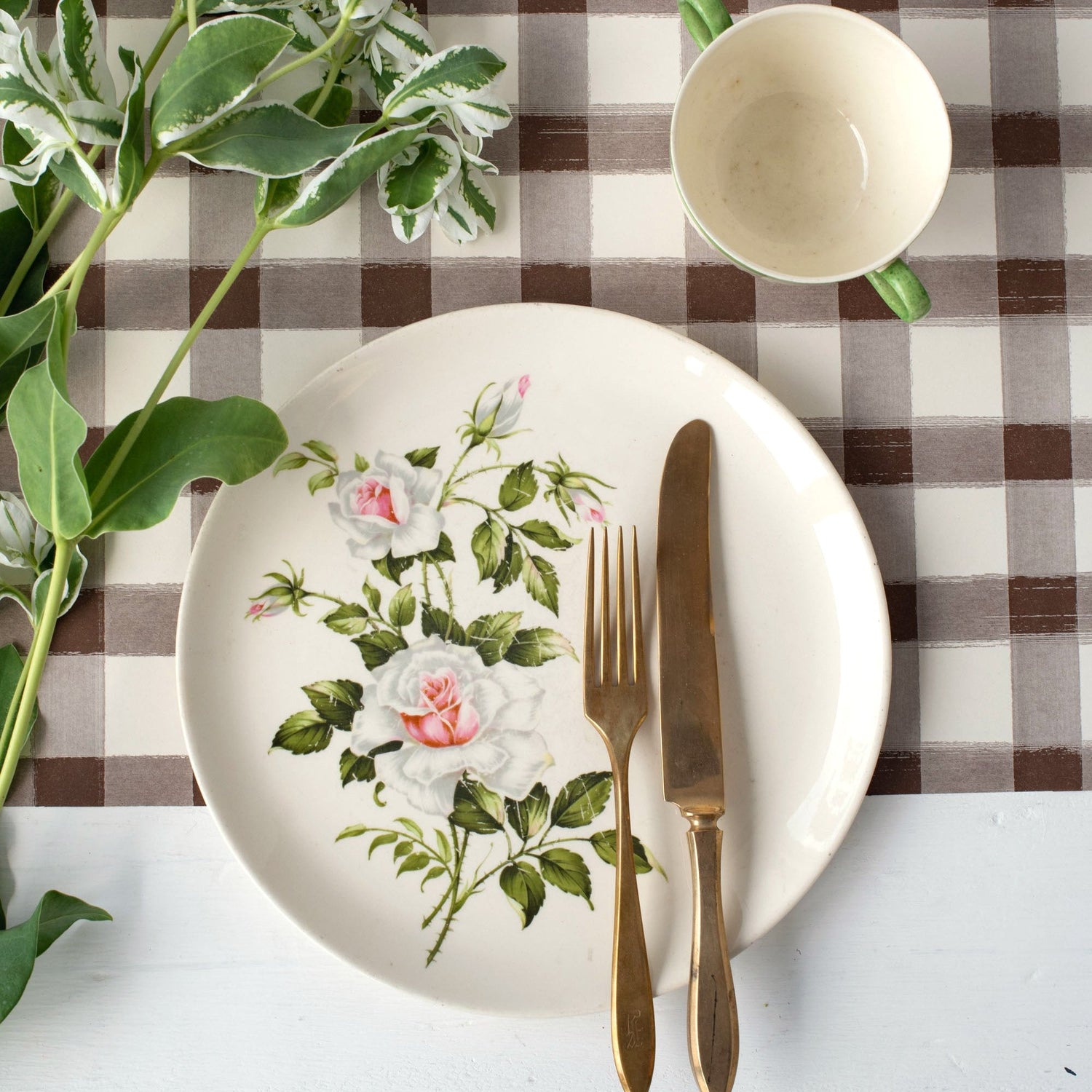 An elegant place setting for tea time featuring the Brown Painted Check Runner.