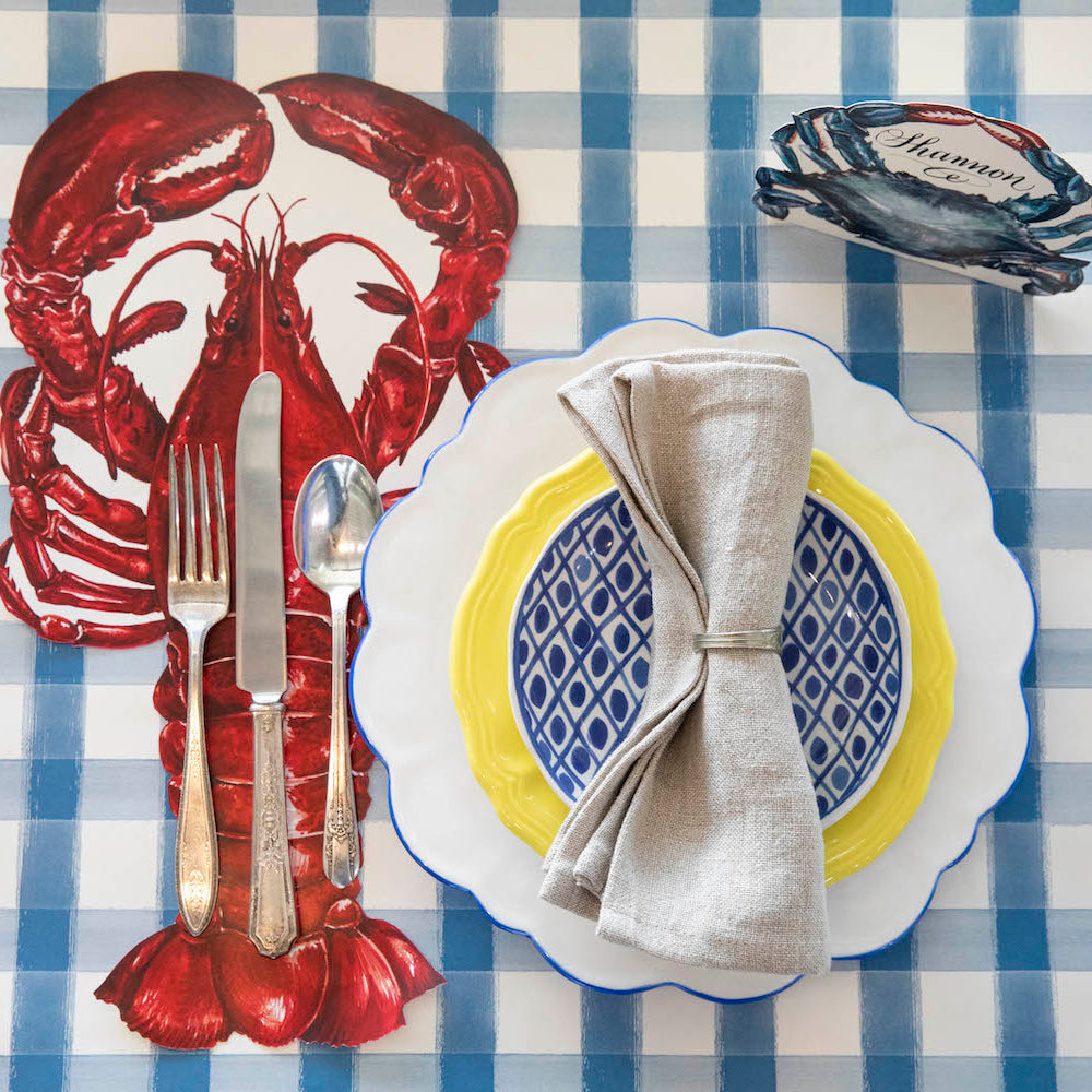 The Blue Painted Check Runner under a nautical-themed place setting.