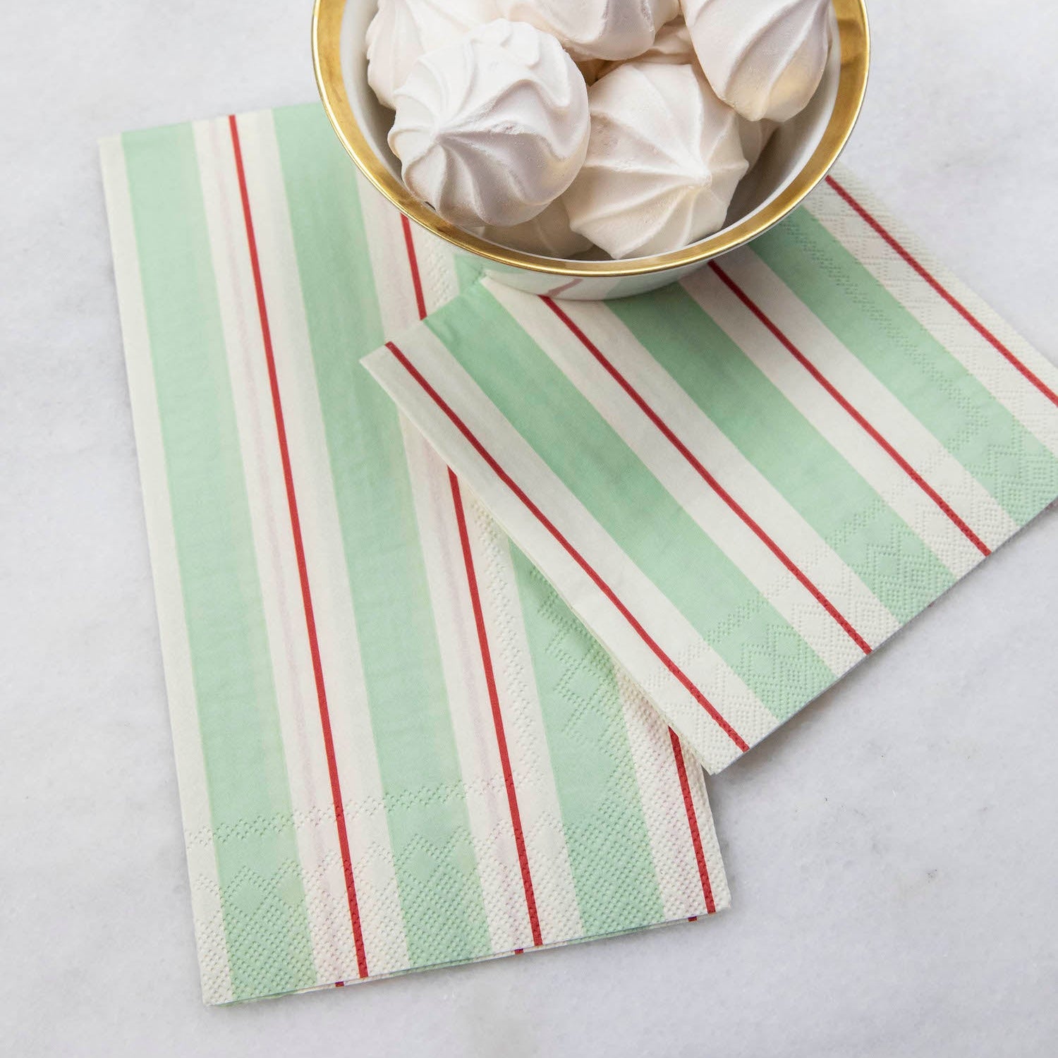 Two Seafoam &amp; Red Awning Stripe Napkins, one Guest and one Cocktail, under a bowl of treats.