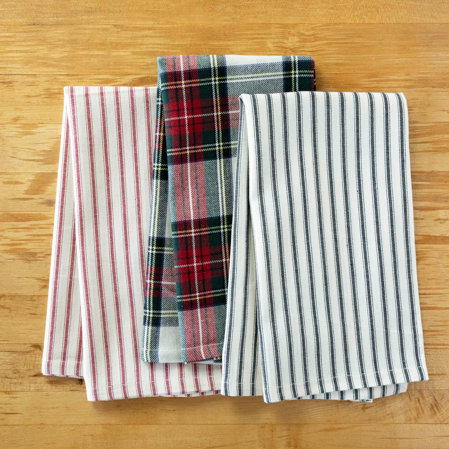 A Taylor Linen Bergen Red Napkin folded on a marble surface for everyday use.