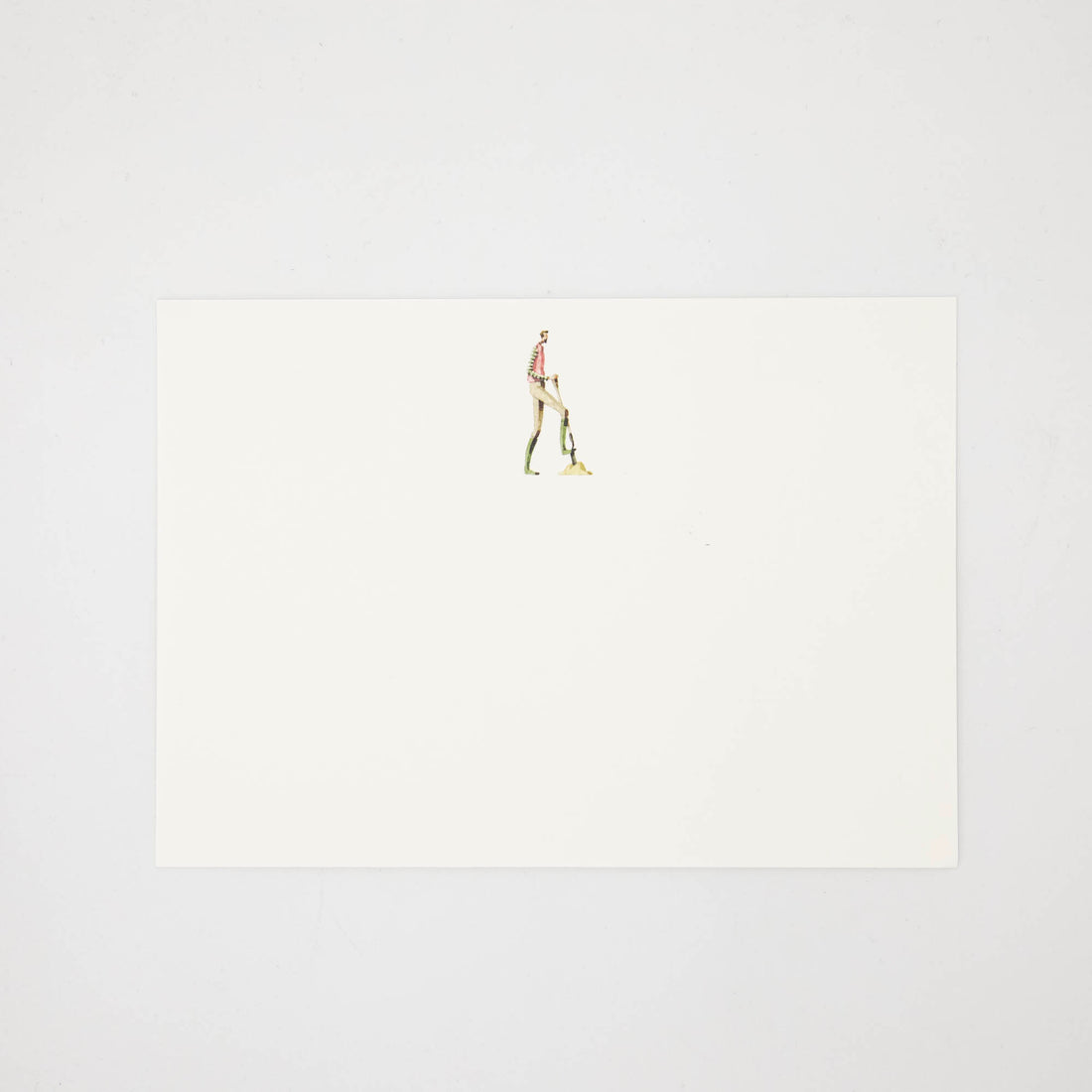 The other side of the note card features an illustration of a man digging with a shovel centered at the top of the card. 
