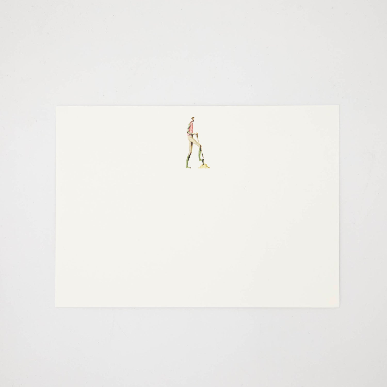The other side of the note card features an illustration of a man digging with a shovel centered at the top of the card. 