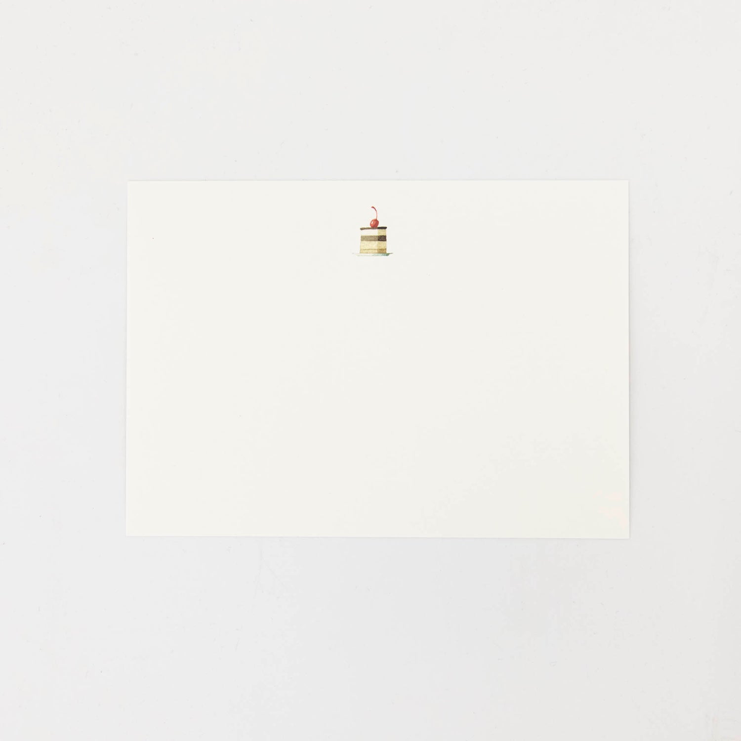 The back of the Cakes Flat Notes card is white with a small illustrated cake slice at the top. 