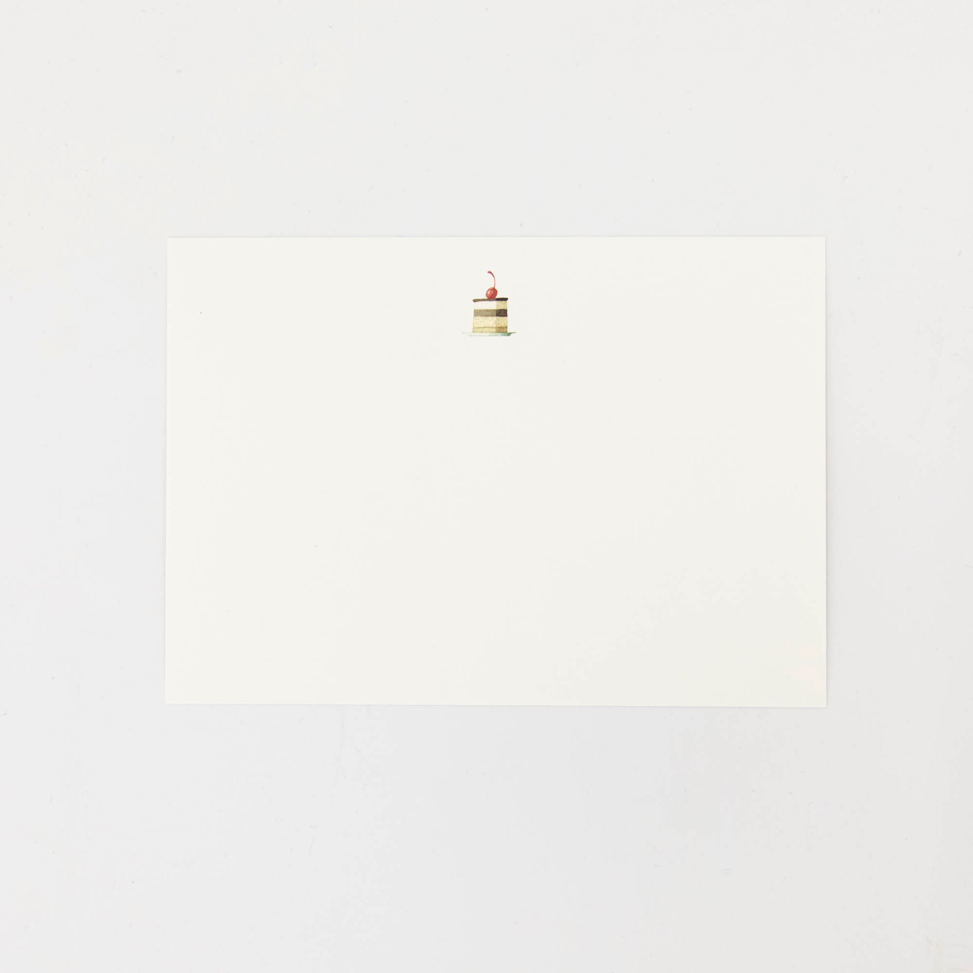 The back of the Cakes Flat Notes card is white with a small illustrated cake slice at the top. 