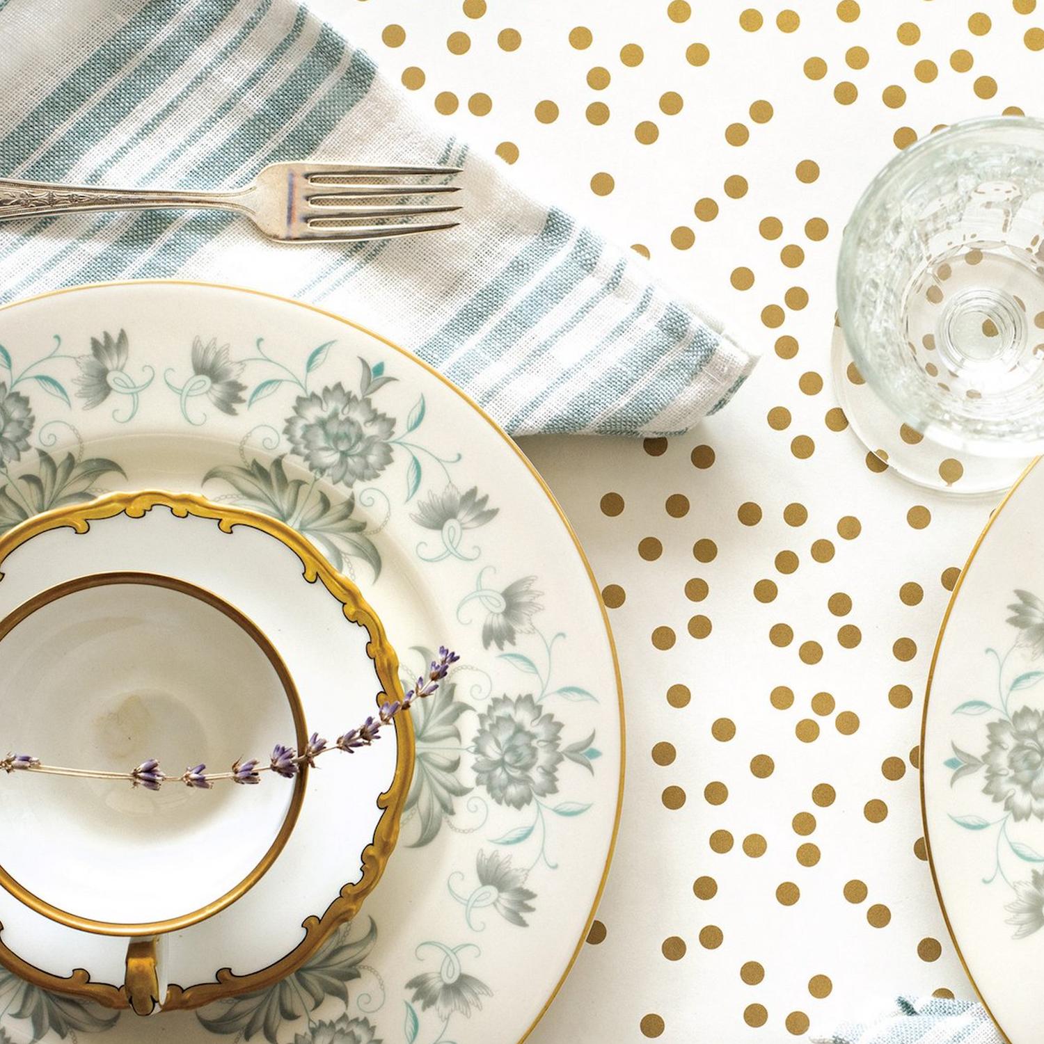 Close-up of the Gold Confetti Runner under an elegant table setting, from above.