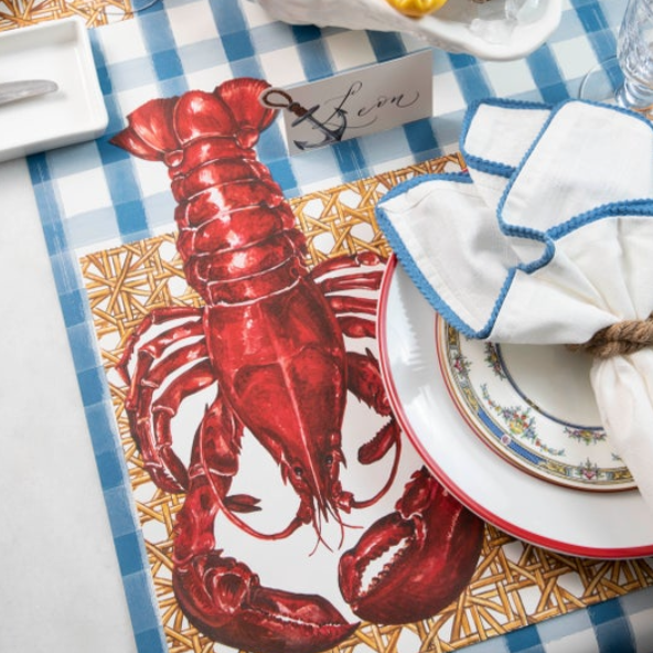 The Blue Painted Check Runner under a nautical-themed table setting with seafood.