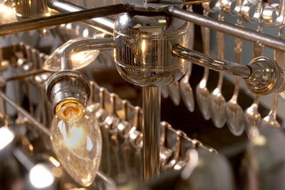 Double Tier Rectangular Spoondelier with multiple reflective pendants against a gray background by Hester &amp; Cook.
