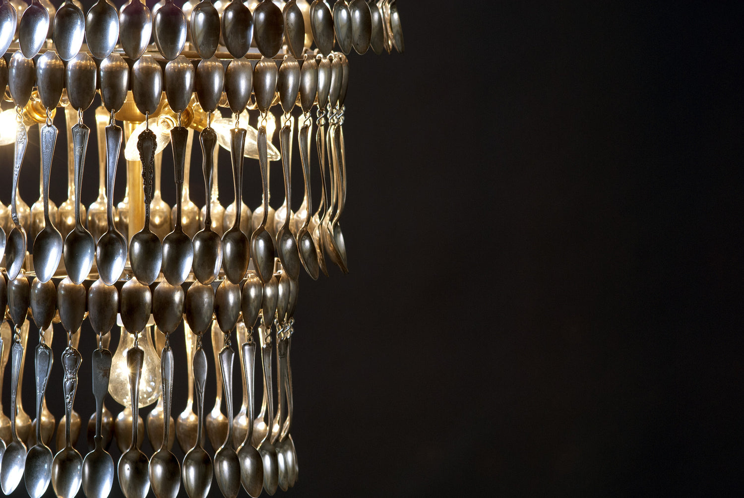 A vintage Quad Tier Spoondelier made out of silver spoons by Hester &amp; Cook.