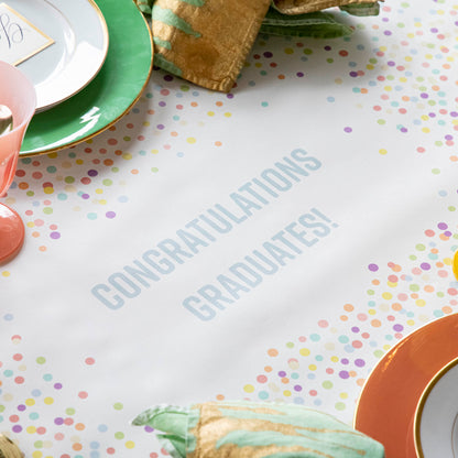 The Confetti Sprinkles Personalized Runner under a festive table setting, with &quot;CONGRATULATIONS GRADUATES!&quot; printed in light blue.