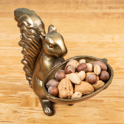 A bronze Accent Decor squirrel holding a bowl of moss.