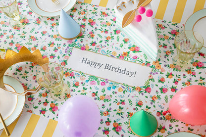 The Sweet Garden Personalized Runner under an elegant Birthday tablescape, with &quot;Happy Birthday!&quot; printed in the middle.