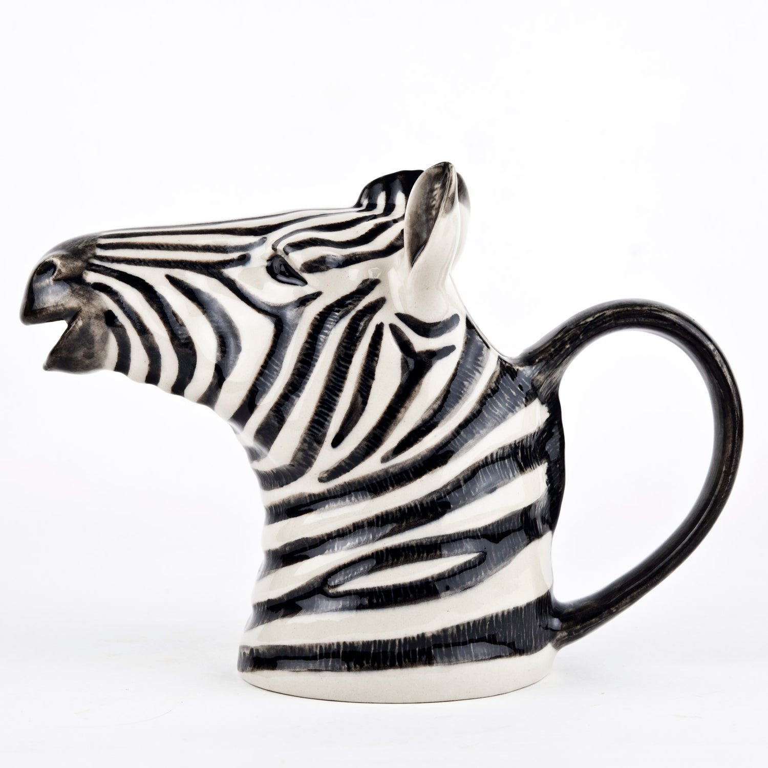 A set of Quail zebra ceramic vases on a wooden table.