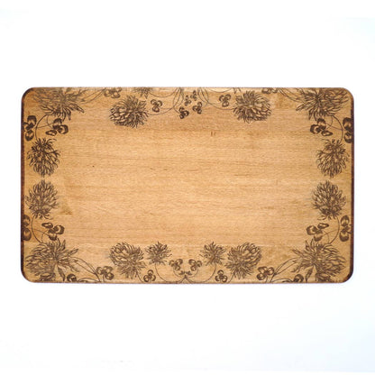 24 x 14 x 0.6 in maple artisan charcuterie board with heirloom distressed finish and hand-engraved clovers on a white background.