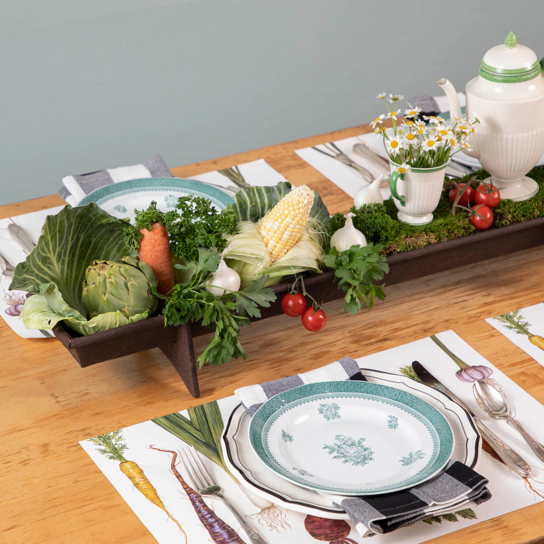 A table with a tray of vegetables on it, featuring a Park Hill Chicken Feeder Centerpiece in rustic style as the centerpiece.