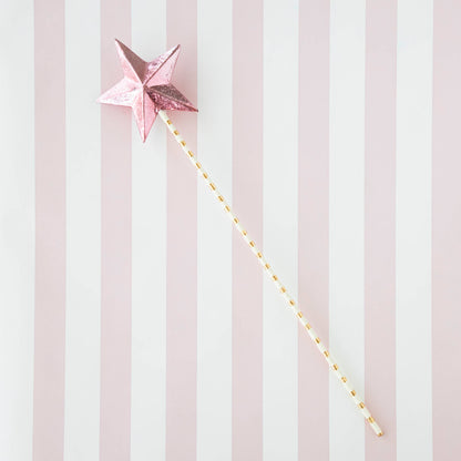 Five Glitterville Magic Wands on a striped background.