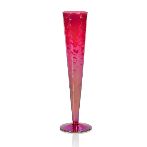 Four Zodax Luster Slim Champagne Flute Glassware with a champagne bottle in an ice bucket in the background.
