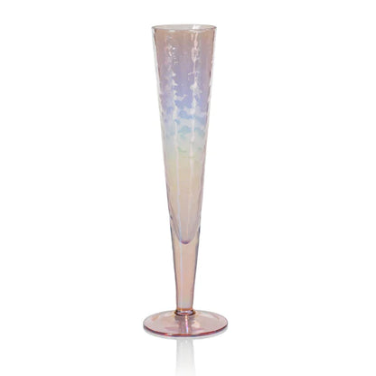 Four Zodax Luster Slim Champagne Flute Glassware with a champagne bottle in an ice bucket in the background.